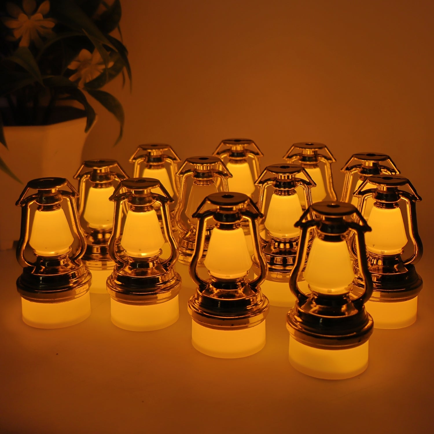 Set of 12 vintage lantern flameless LED candles emitting warm yellow light