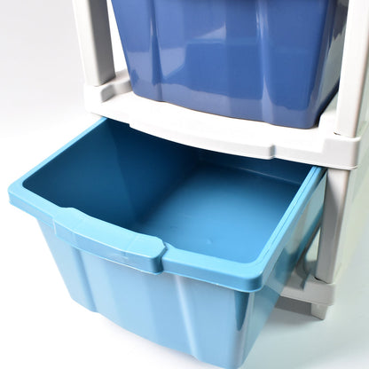 Close-up view of the transparent drawers of the 4-layer plastic storage unit, showing contents.
